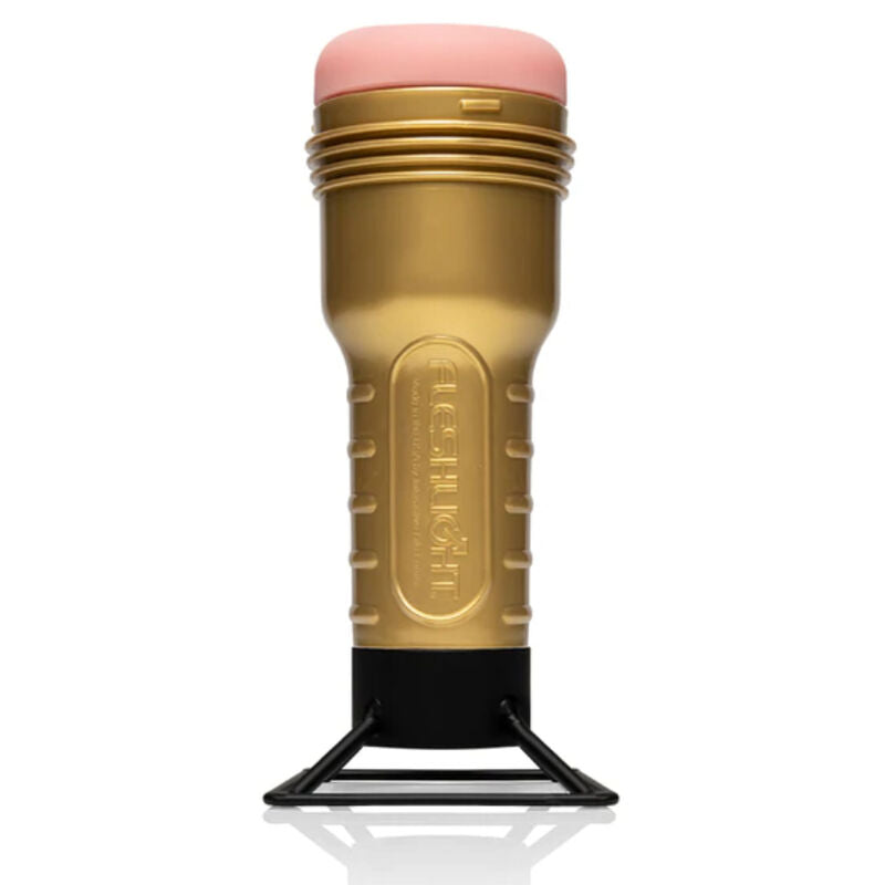 Fleshlight mit goldenem Gehäuse aufrecht auf dem schwarzen Trockenständer Screw Dry
