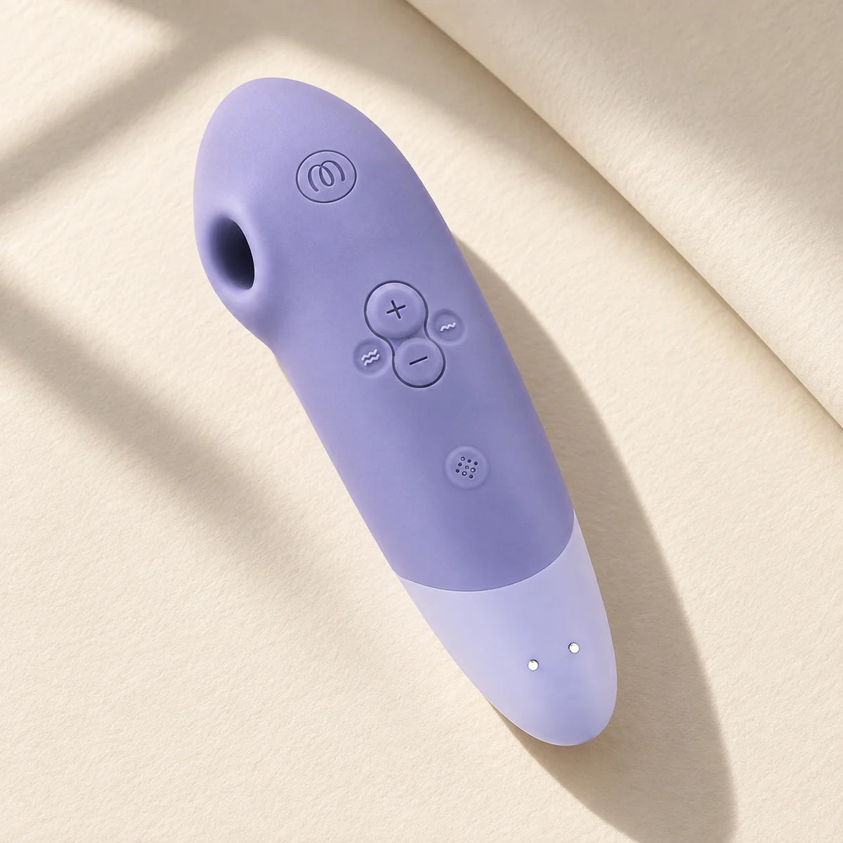Womanizer Enhance lilas sur papier ivoire