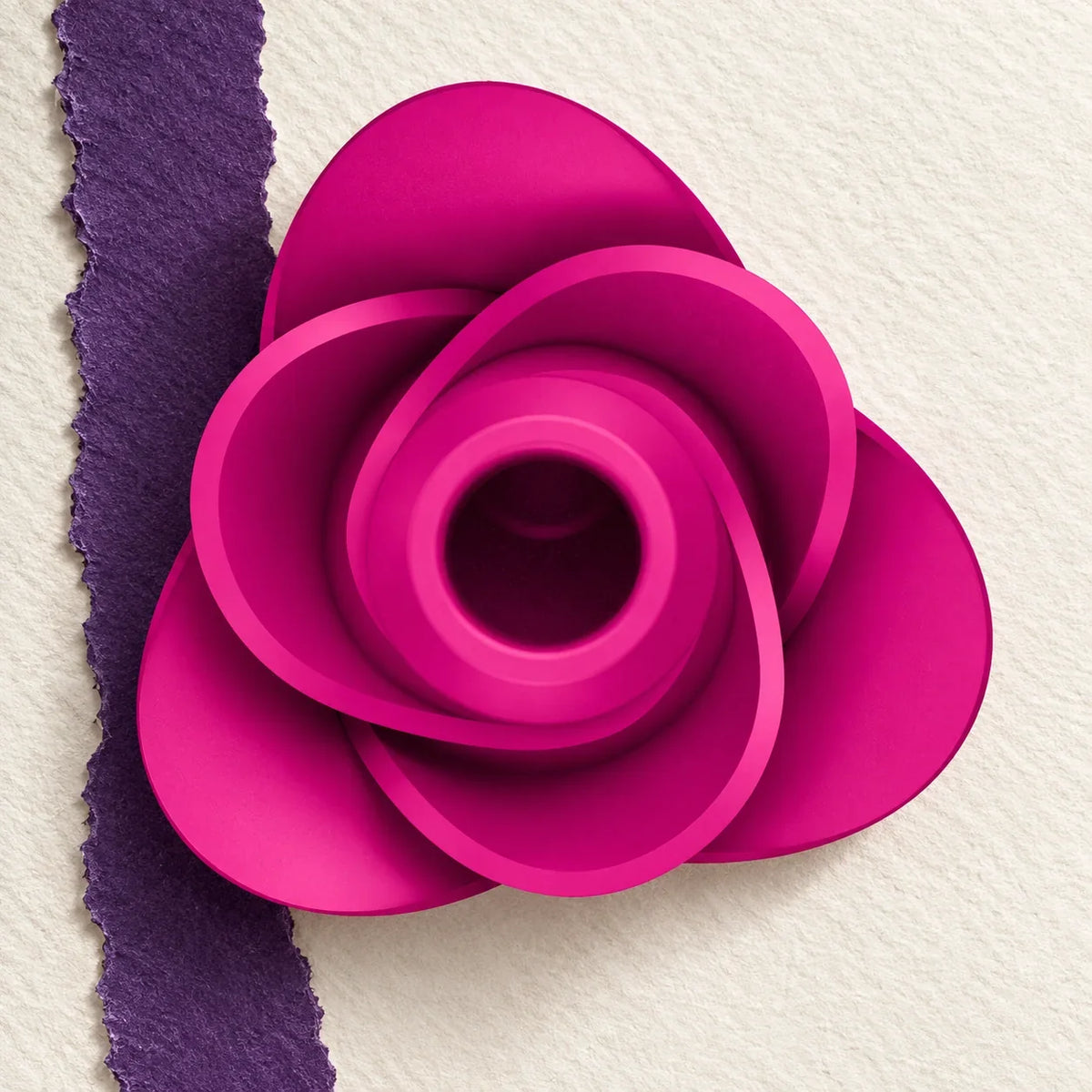 Satisfyer Pro 2 Modern Blossom rose sur une étoffe claire.