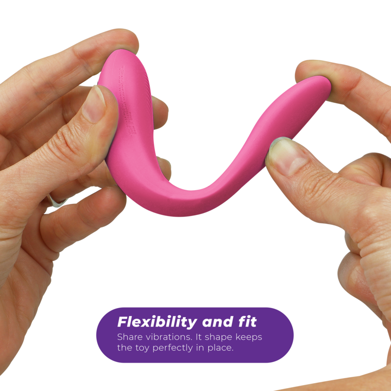 Zwei Hände biegen den Sync Lite in Rosa und zeigen seine Flexibilität